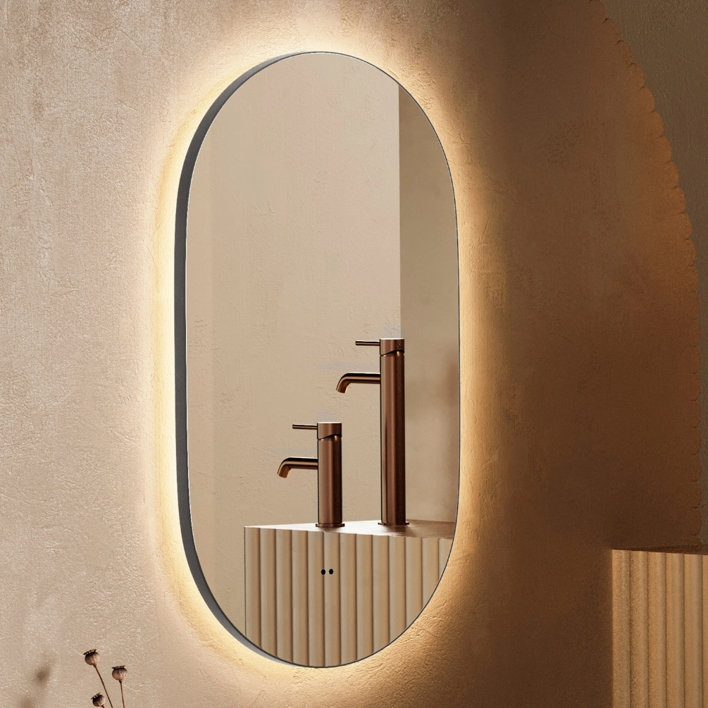 Lifestyle image of the hib. Arcane Pill 500mm x 900mm Gunmetal Illuminated Frame Mirror